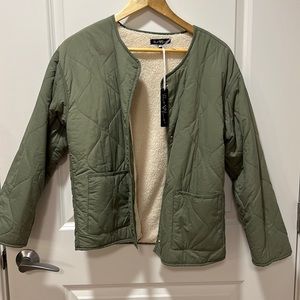 Light weight bomber/puffer jacket with fleece interior.